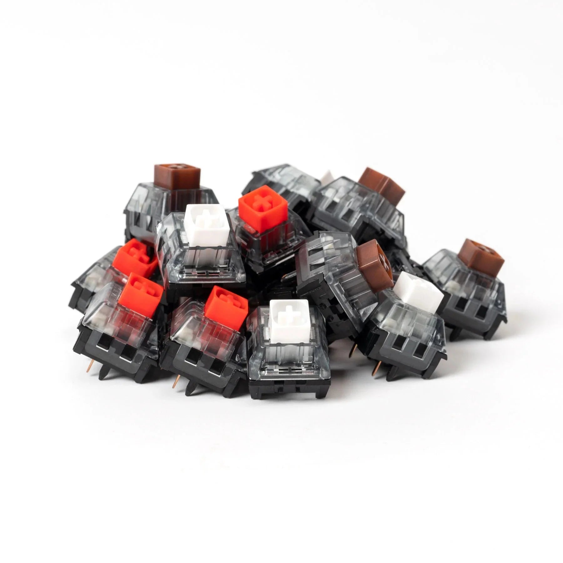 Box V2 switches assortment with red, white, and brown keycaps in clear housings