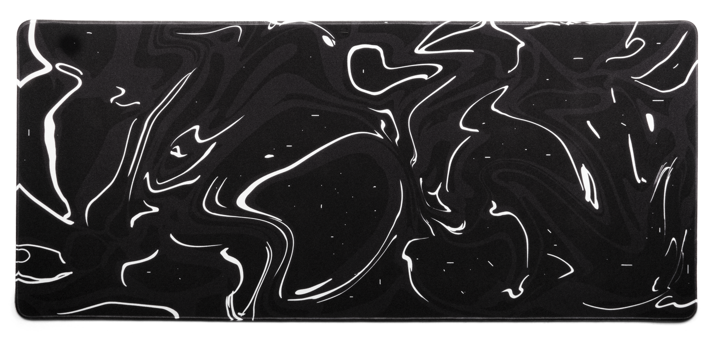 Black desk mat with white marble swirl pattern and thin stitched border