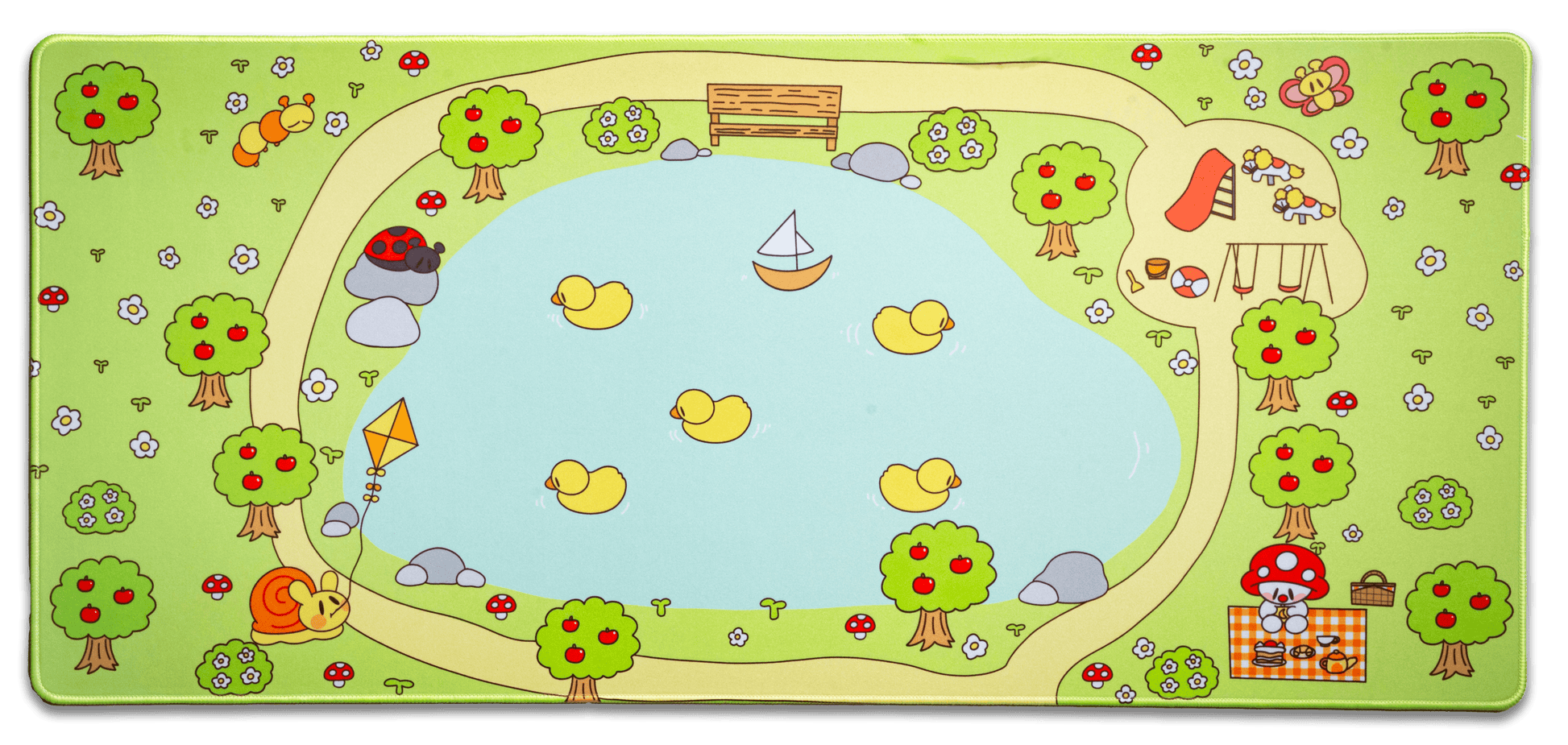 Picnic desk mat with green border and cartoon trees, mushrooms, and picnic scene