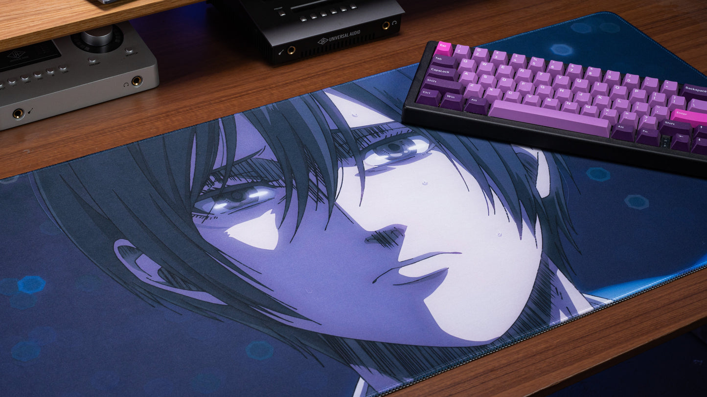 Anime desk mat close-up of blue-tinted character face with profile eyes