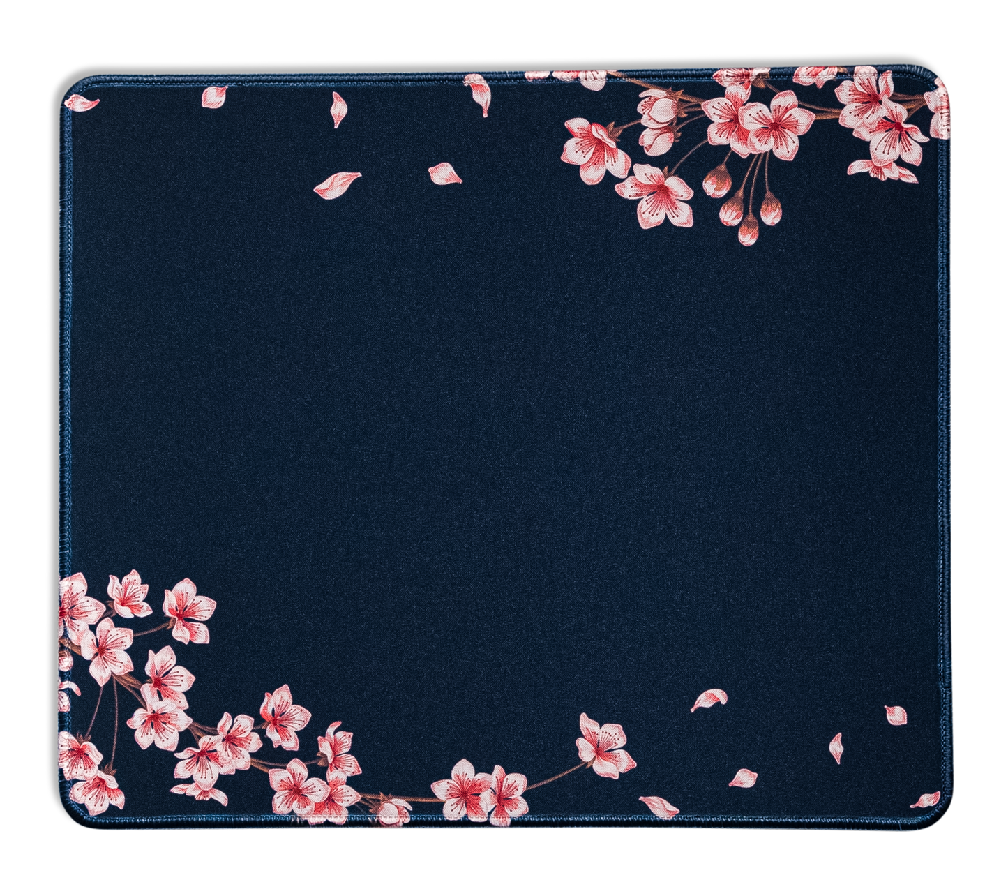 Navy desk mat with pink blossoms along edges and scattered leaf accents; stitched edge