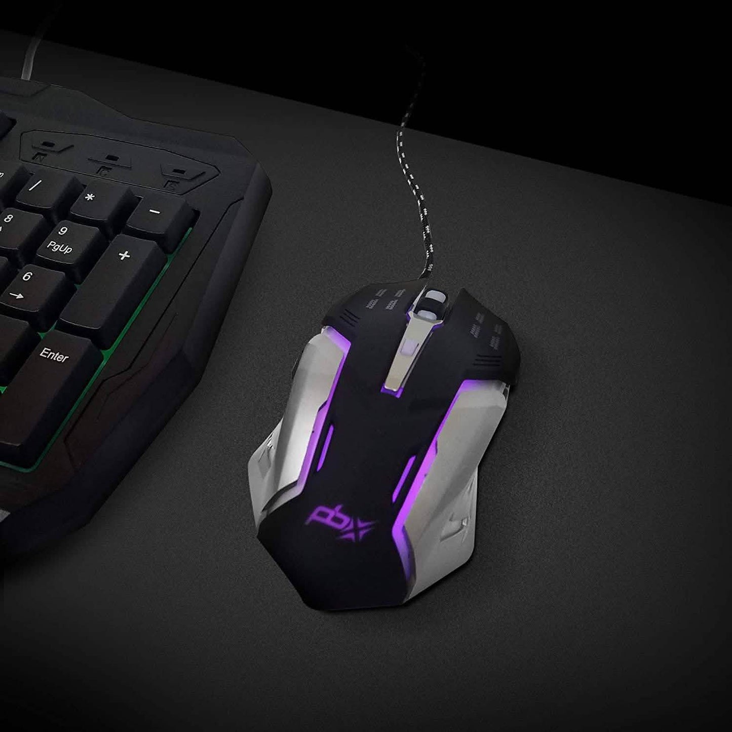 Wired gaming mouse on desk with purple LED light strips and ergonomic shape