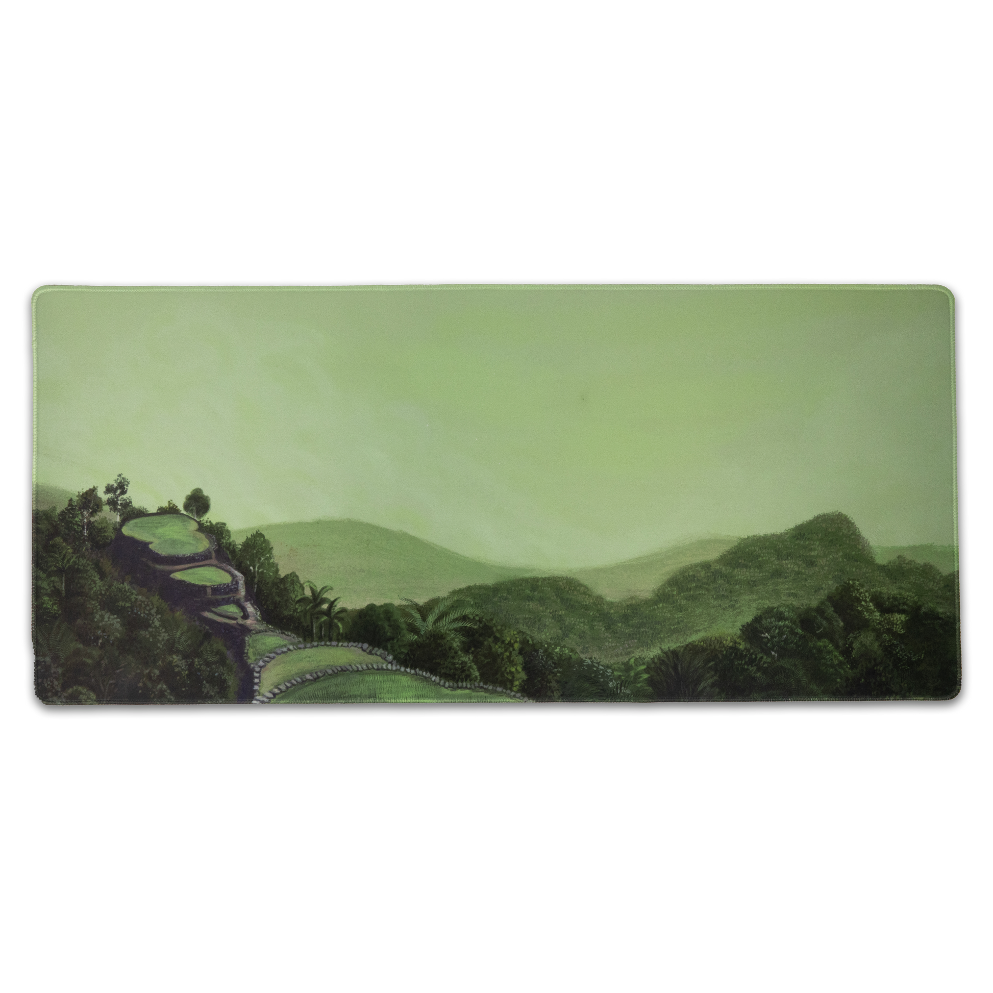 Rectangular green landscape desk mat with dark border and forest path scene