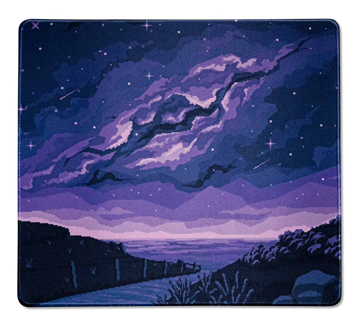 Rectangular pixel desk mat with purple comet streak, star speckles, and twilight horizon