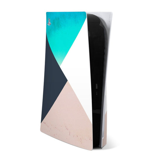 Sony PS5 skin with geometric teal, navy, white, and blush pattern covering console