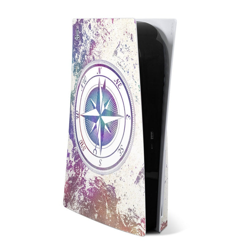 PS5 console skin with distressed compass rose design, purple and teal on light background