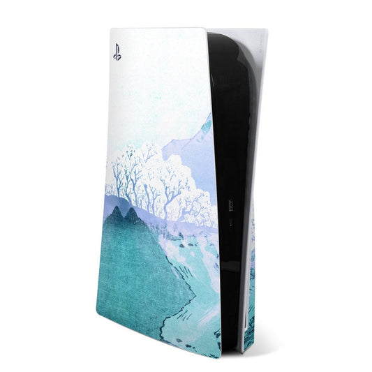 Sony PS5 skin with blue mountain and snowy trees landscape design, shown on retail sleeve