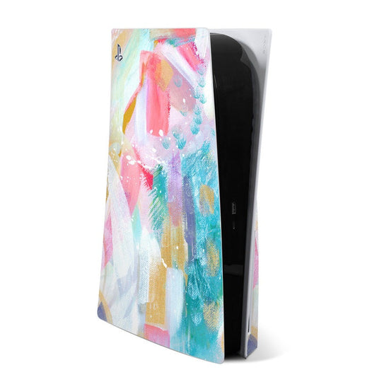 PS5 skin with colorful abstract paint splatter on black console front and side