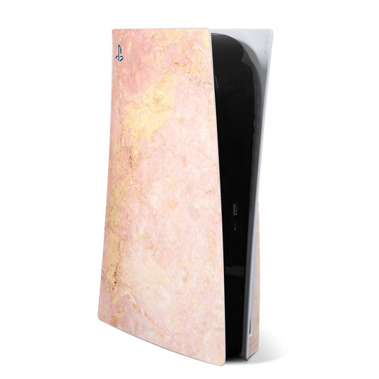 Rose Gold Marble PS5 skin with marbled pink and gold finish, partial console view in box
