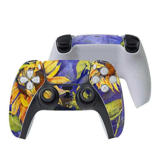 PS5 controller skin with purple and yellow floral artwork on front grips and buttons