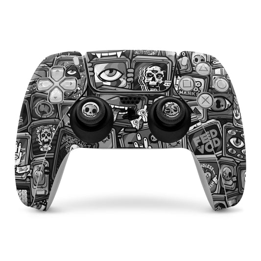 PS5 controller skin, black-and-gray comic skull and gadget graphics