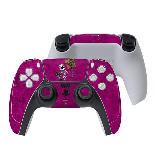 Purple PS5 controller skin with skull and gamer graphic over front buttons