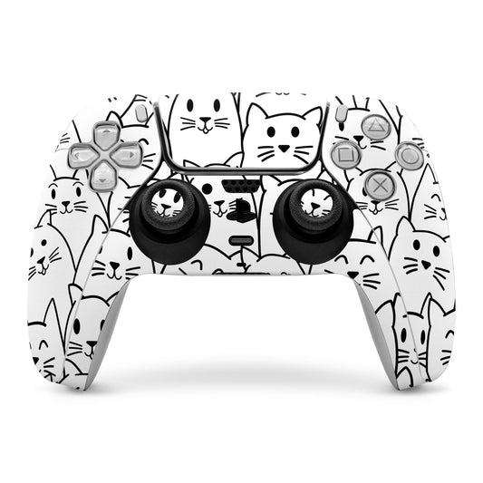 PS5 controller skin with white cat faces and black thumbstick caps