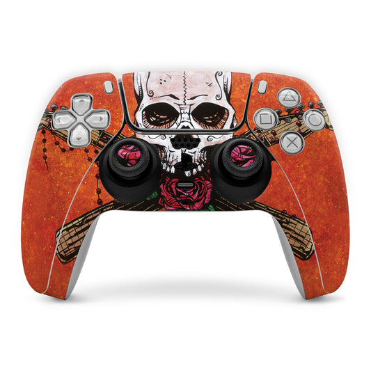 PS5 controller skin with orange skull graphic and decorated thumbstick caps