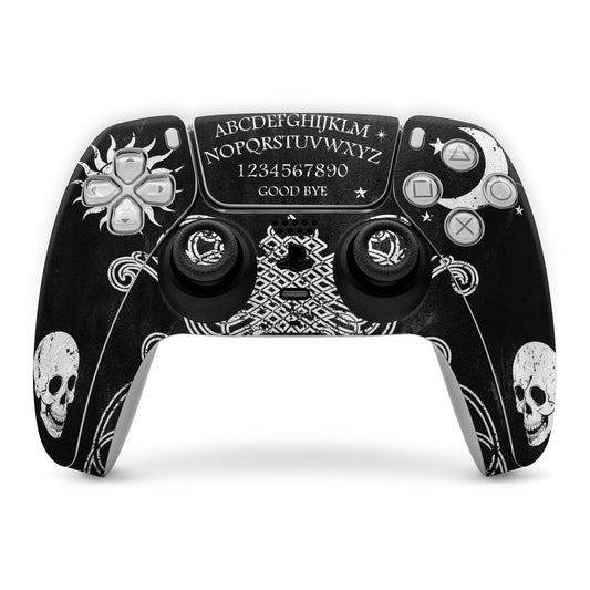 PS5 controller skin in black with Ouija-style letters, skulls and flame icons