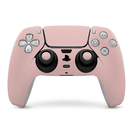 PS5 controller skin in faded rose pink with cutouts for buttons and sticks