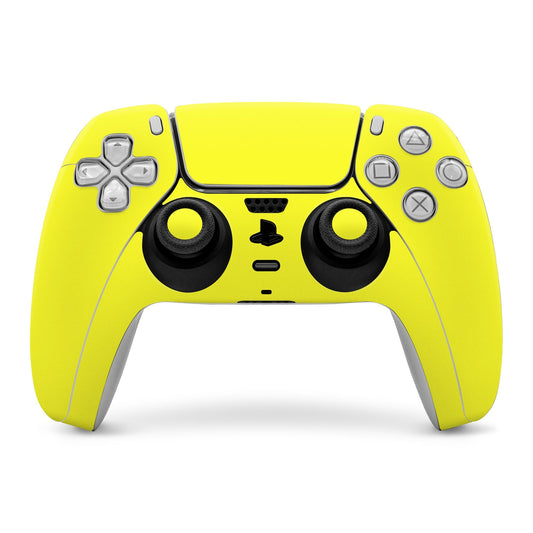 Yellow PS5 controller skin with black grips and button cutouts