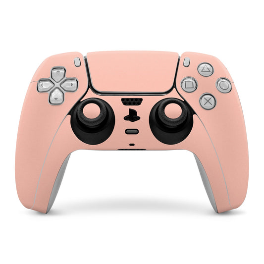 Peach PS5 controller skin cover with button cutouts and thumbstick grips