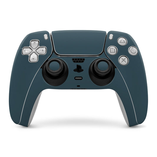 Dark teal PS5 controller skin covering front and buttons, with analog stick cutouts