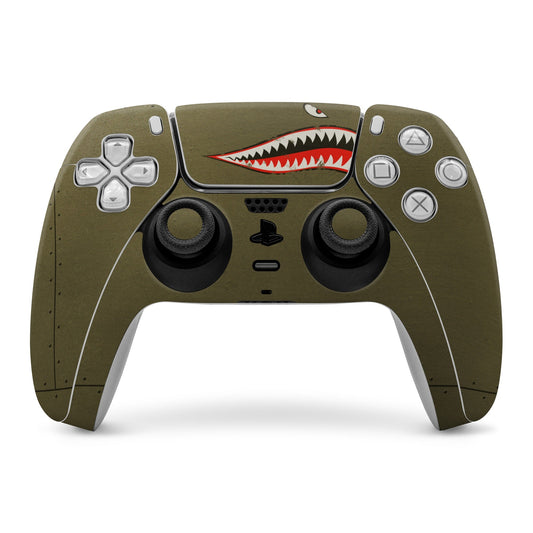 Olive PS5 controller skin with shark mouth graphic over front buttons and thumbsticks