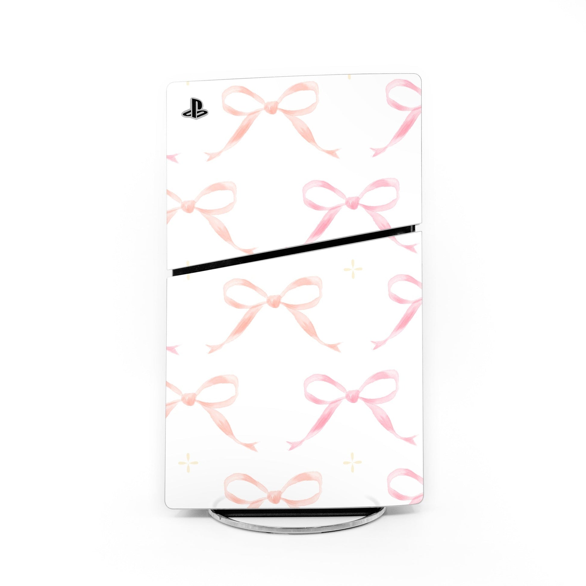 PS5 Slim console skin with pink bow pattern and black horizontal accent stripe