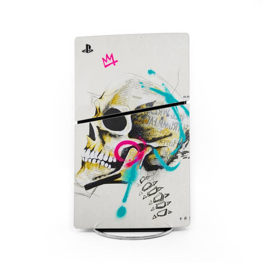 PS5 Slim console skin with PlayStation logo, graffiti skull and colorful splatter art