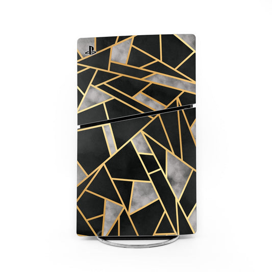 PlayStation 5 Slim skin with black base and gold geometric line pattern, glossy finish