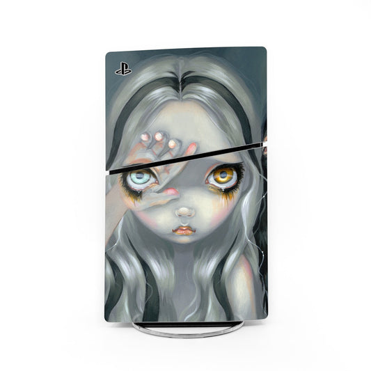 PlayStation PS5 Slim skin decal with stylized pale face artwork in cool blue and gray