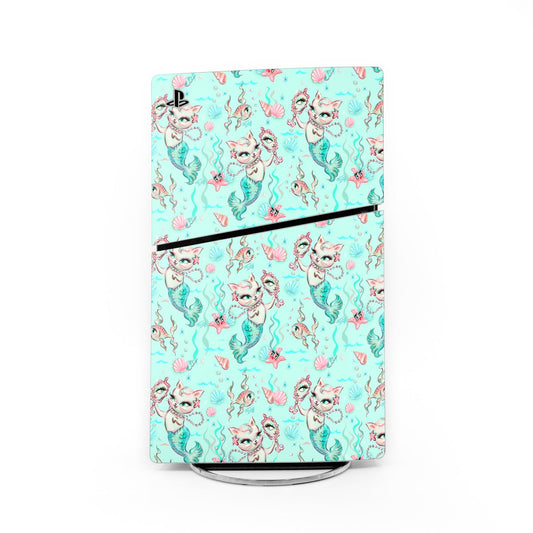 Aqua PS5 Slim console skin with mermaid cat pattern and pearl accents