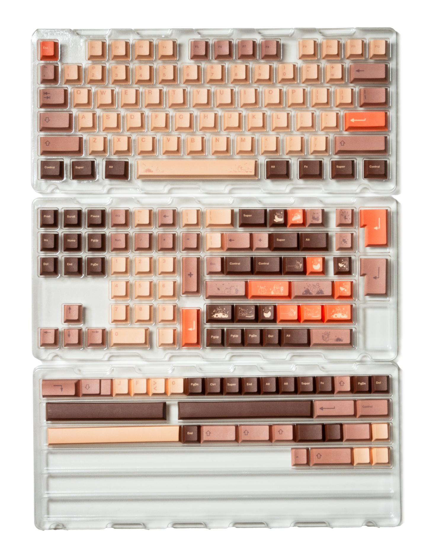 Set of beige, brown, and orange keycaps with themed legends in clear tray