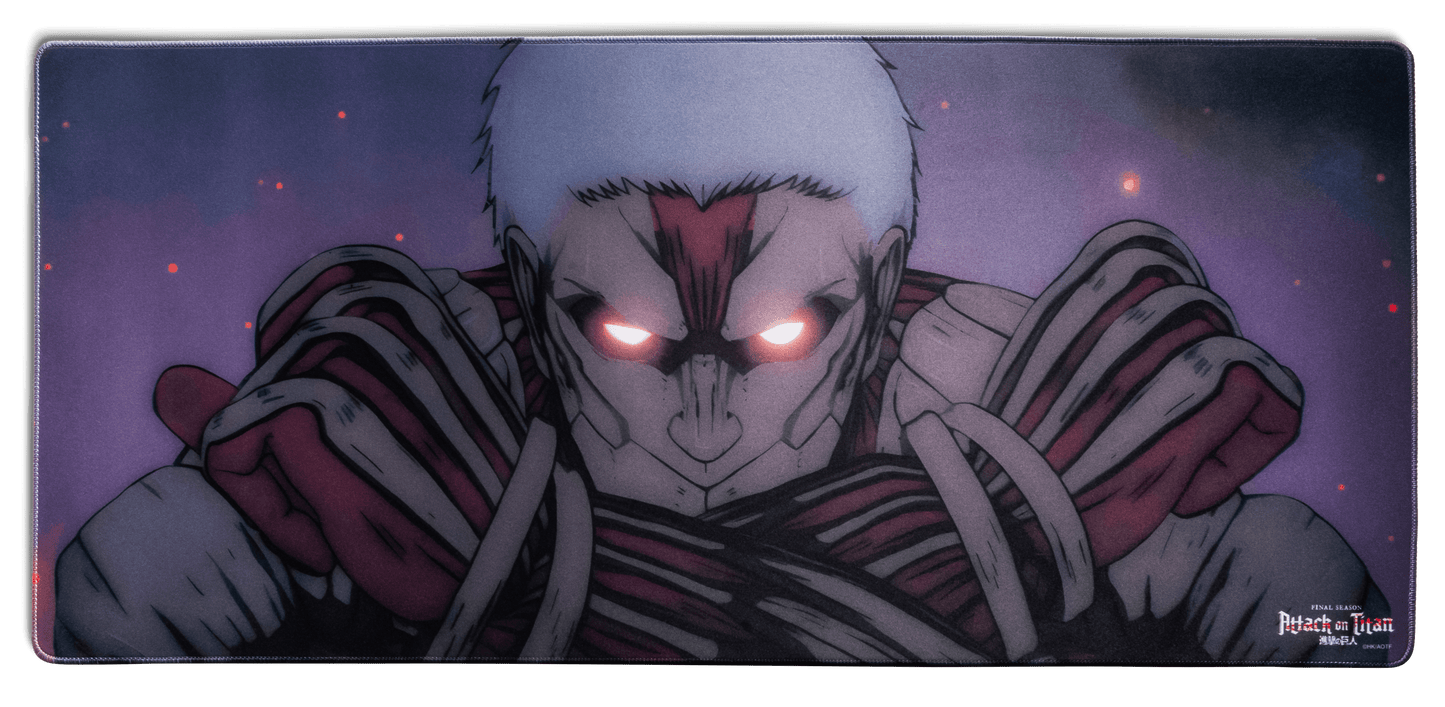 Desk mat featuring a glowing-eyed titan close-up with striped bandages