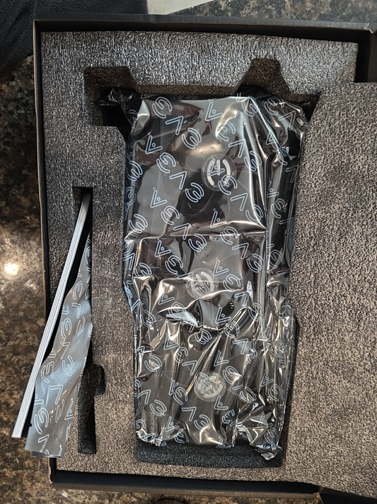 EVGA GPU accessory bag in clear anti-static packaging inside foam tray