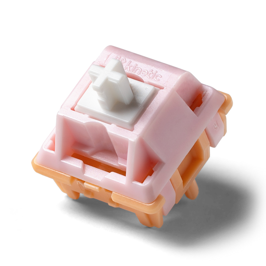 Kinetic tactile switch with pink housing and white cross stem, side view