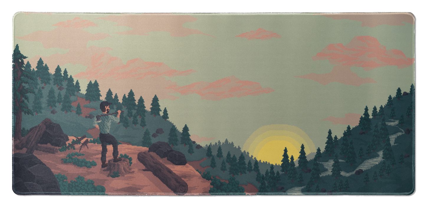 Rectangular desk mat with pixel art landscape sunrise scene and stitched border