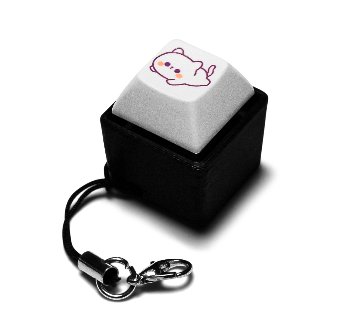 Single keycap fidget with animal-printed white key, black case, keychain ring