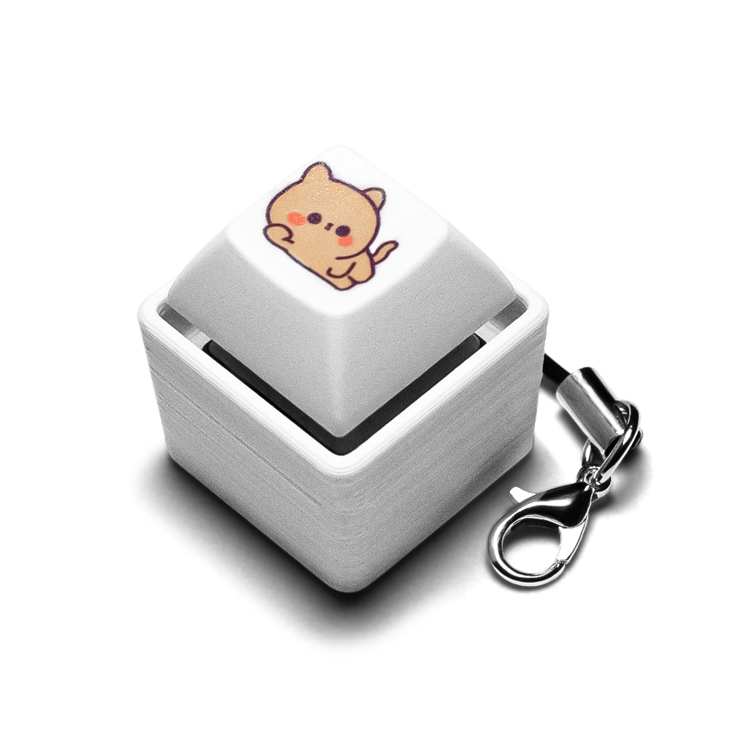 Single keycap fidget with animal-printed white key, silver case, metal keychain clip