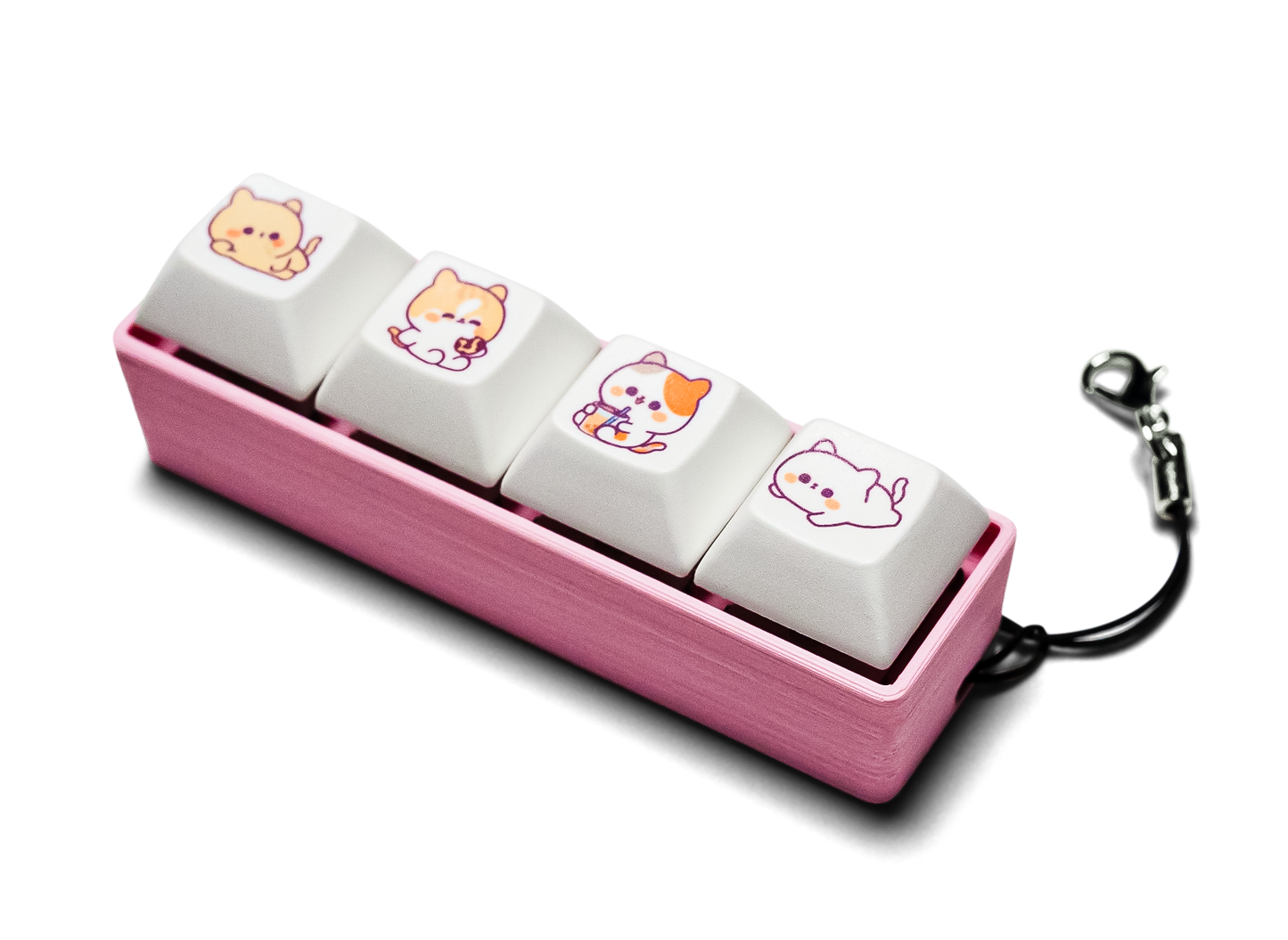 Four-piece keycap fidget with animal-printed white keys, pink case, keychain clip