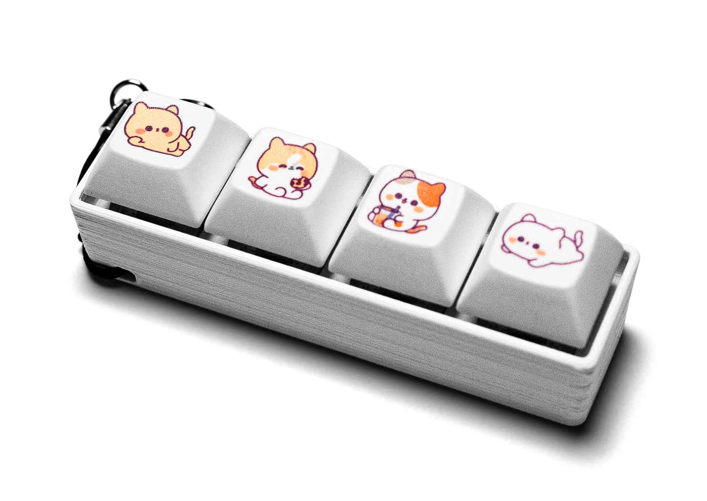 Four-piece keycap fidget with animal-printed white keys and silver case, keychain ring