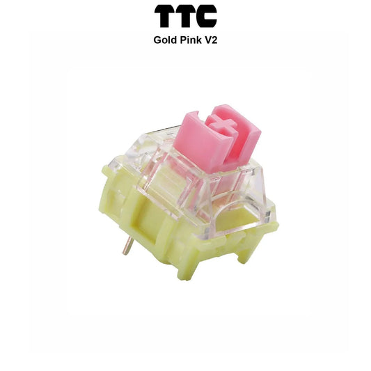 TTC Gold Pink V2 keyboard switch with translucent yellow housing and pink stem, pins visible