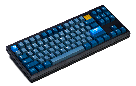 Blue PBT keycap set with whale-themed legends on a full keyboard layout