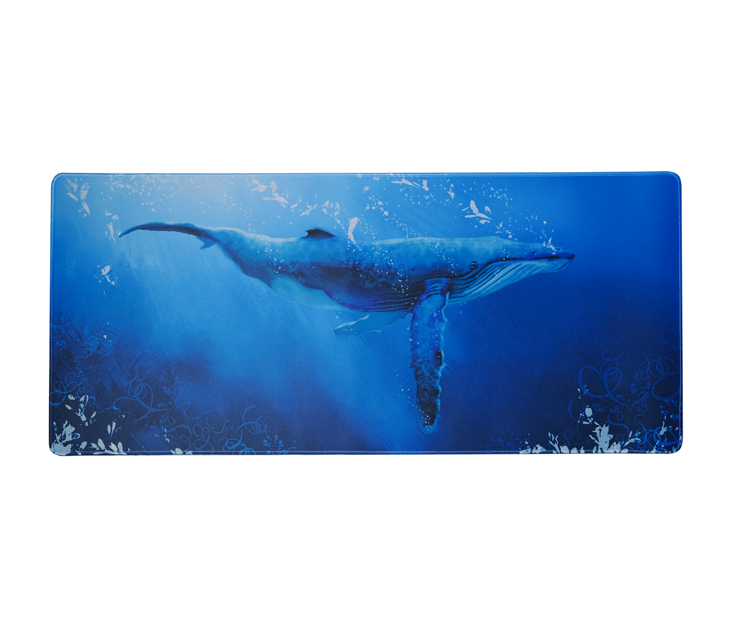 Desk mat with centered blue whale graphic, rounded corners