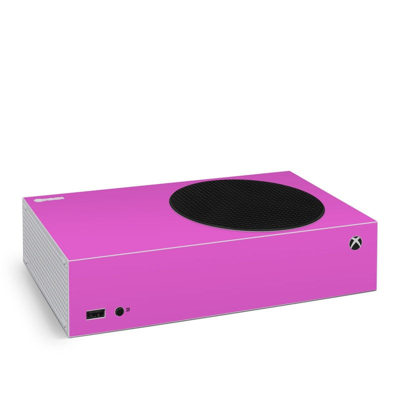 Vibrant pink Xbox Series S skin with circular vent cutout and port icons
