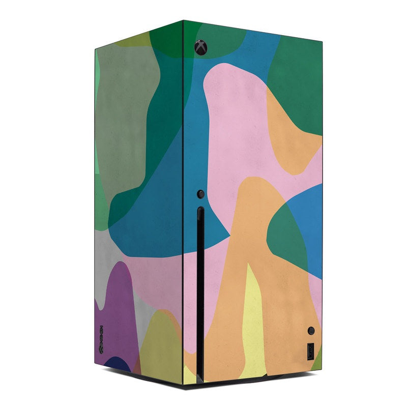 Xbox Series X skin with abstract camo pattern in green, pink, blue, and tan
