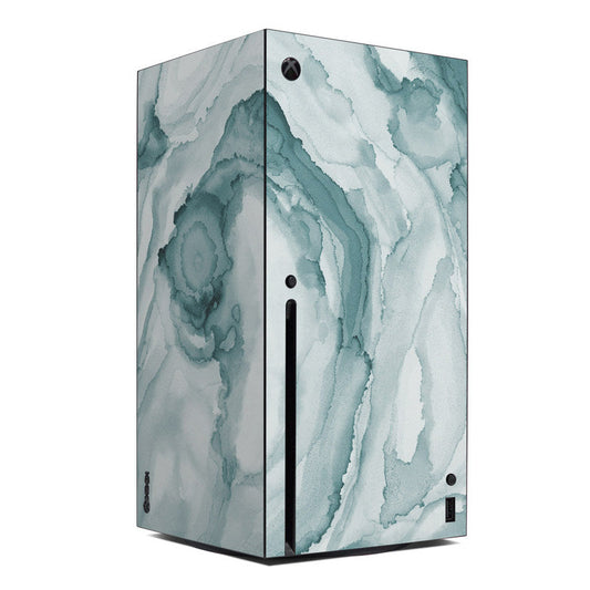 Microsoft Xbox Series X skin with teal and white cloud-like marble pattern, front vents cutouts