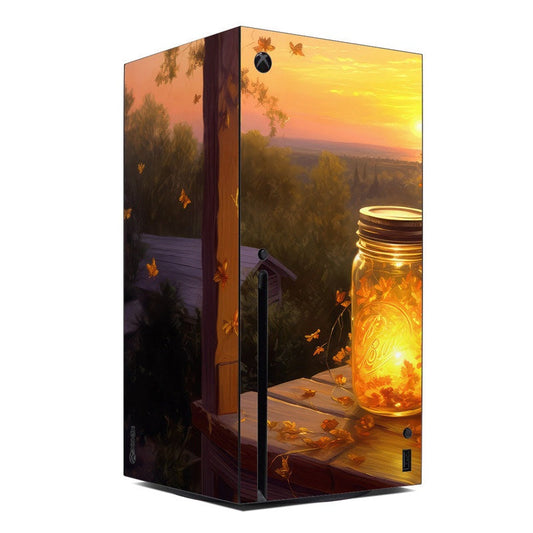 Xbox Series X console skin with warm sunset landscape, butterflies, and a glowing jar design
