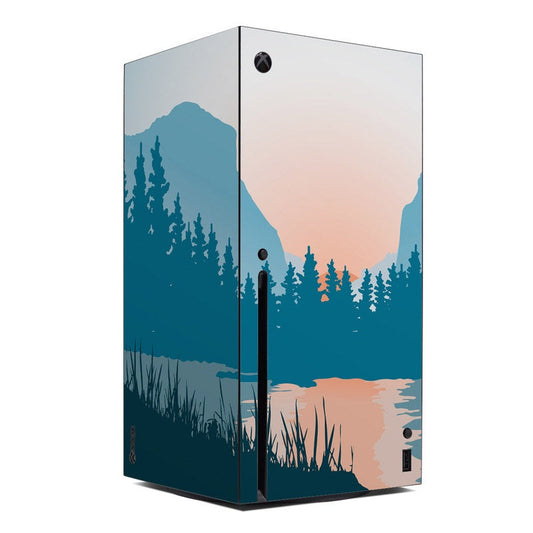 Xbox Series X console skin with blue forest and pink sunset landscape design