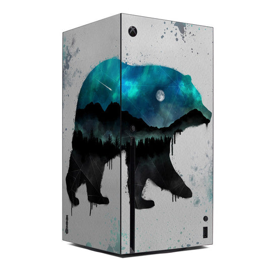 Xbox Series X console skin with blue teal alien-like splatter and forest silhouette graphic