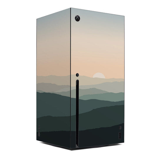 Xbox Series X console skin with layered mountain landscape and sunset gradient