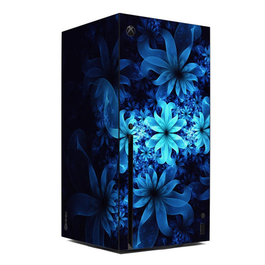 Xbox Series X console skin with luminous blue floral pattern on dark surface