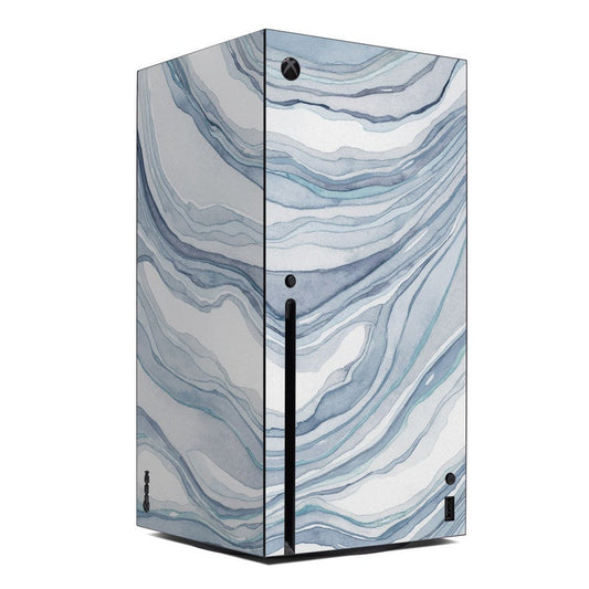 Xbox Series X console skin with blue marbled sandstone wave pattern and front logo.